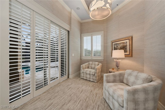 sitting room with ornamental molding