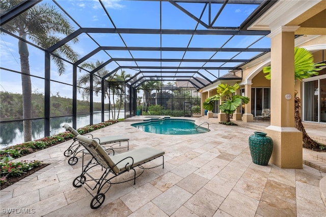 view of swimming pool with a water view, a patio area, and a lanai