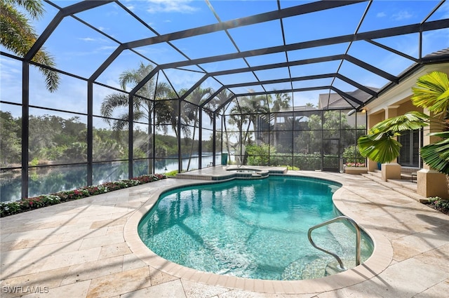 view of pool featuring a lanai, a patio area, and a water view