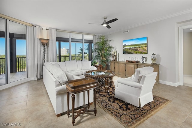 23850 Via Italia Cir Unit 406, Estero, FL 34134 - living room with a ceiling fan, crown molding, light tile patterned flooring, baseboards, and visible vents