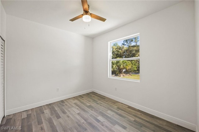 unfurnished room featuring hardwood / wood-style floors and ceiling fan