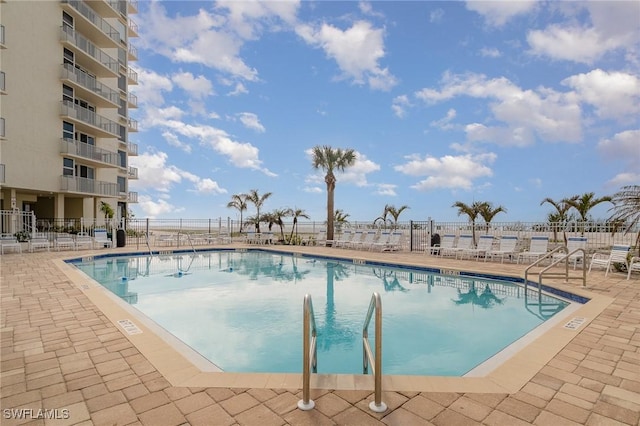 view of swimming pool with a patio