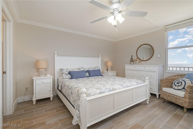 bedroom featuring ceiling fan and crown molding