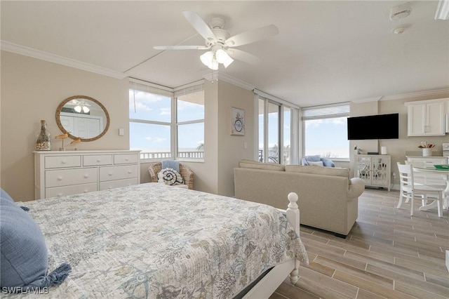 bedroom with ceiling fan, light hardwood / wood-style flooring, and crown molding