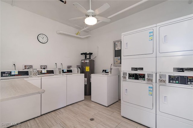 laundry area with ceiling fan, washing machine and dryer, stacked washer and dryer, and water heater