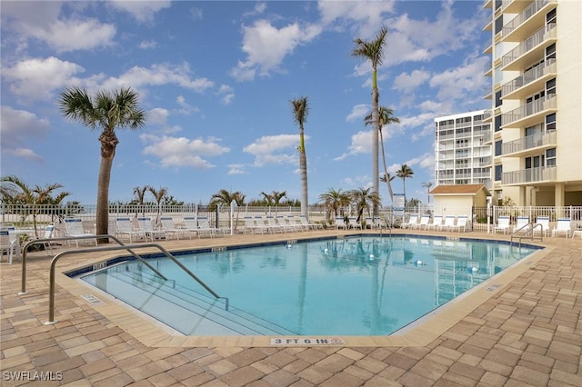 view of swimming pool with a patio area