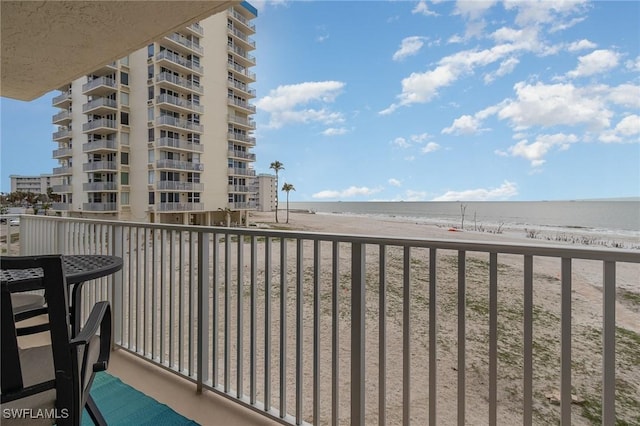 balcony with a view of the beach and a water view