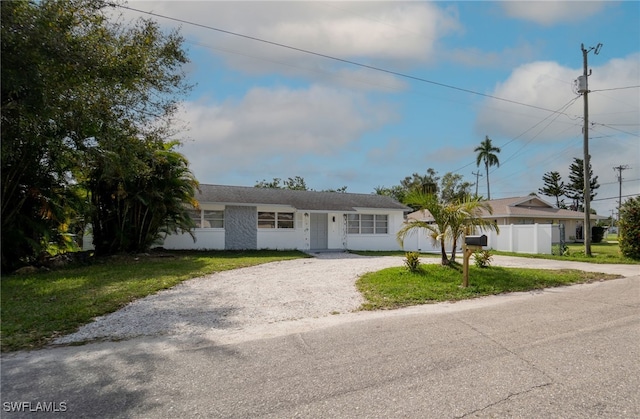 single story home featuring a front yard