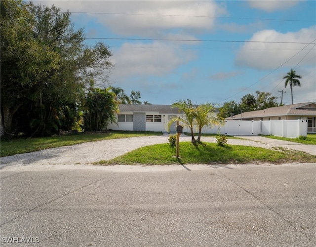 ranch-style home with a front yard