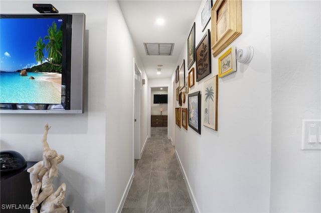 corridor with tile patterned flooring