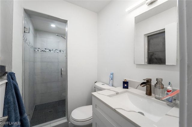 bathroom with vanity, toilet, and an enclosed shower