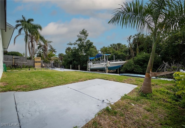 view of community featuring a yard and a patio