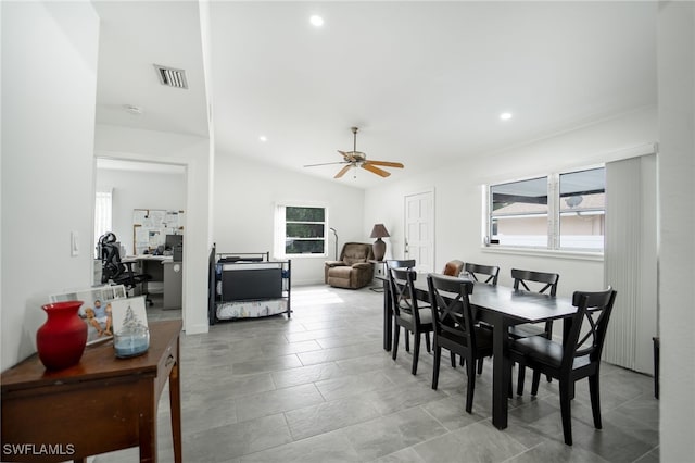 dining room with ceiling fan and lofted ceiling