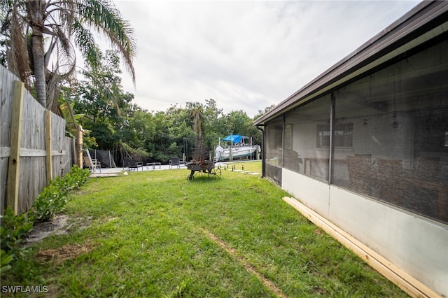 view of yard with a sunroom