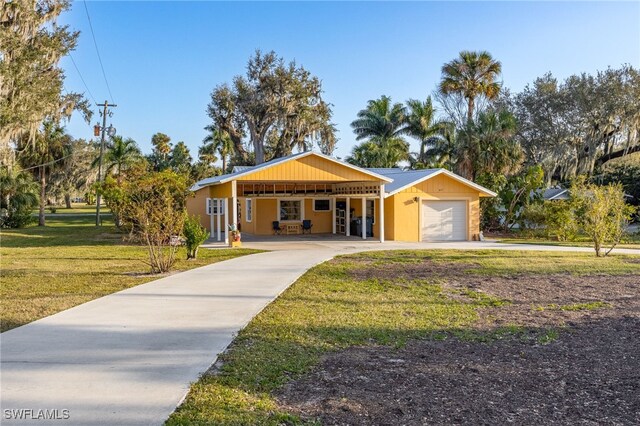 single story home with a front lawn and a carport