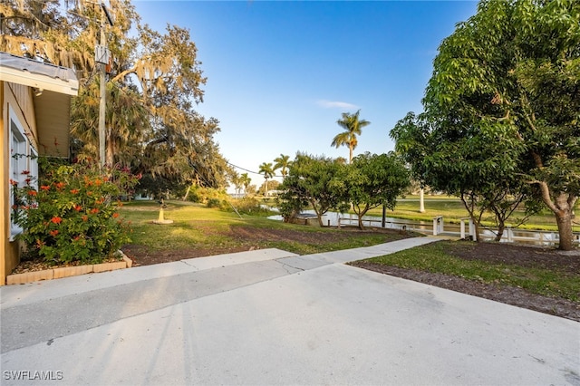 view of home's community with a yard