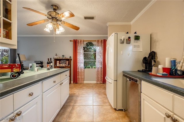 kitchen featuring dark countertops, visible vents, dishwasher, ornamental molding, and a ceiling fan