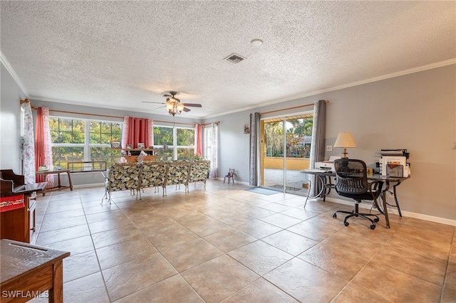 interior space with visible vents, crown molding, baseboards, a textured ceiling, and a ceiling fan