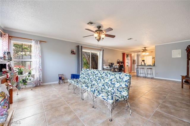 interior space featuring crown molding, plenty of natural light, and a ceiling fan