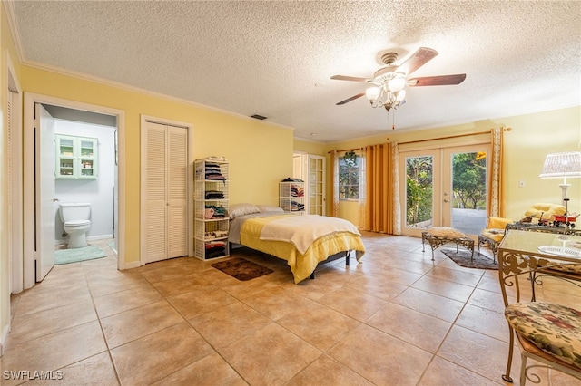 bedroom featuring access to exterior, french doors, crown molding, and light tile patterned flooring