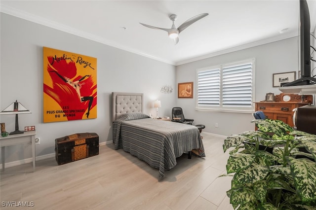 bedroom with ceiling fan, crown molding, and light hardwood / wood-style floors