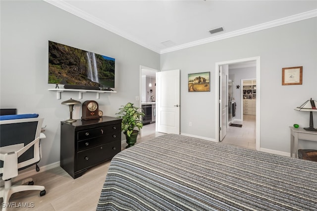 bedroom with ensuite bathroom and ornamental molding