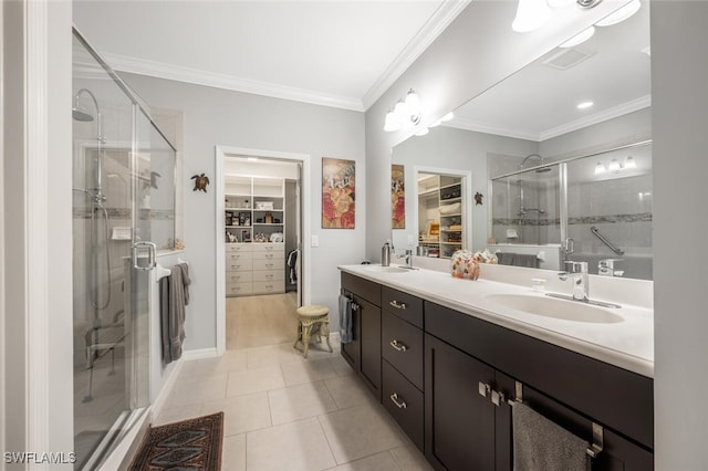 bathroom featuring tile patterned flooring, vanity, walk in shower, and ornamental molding