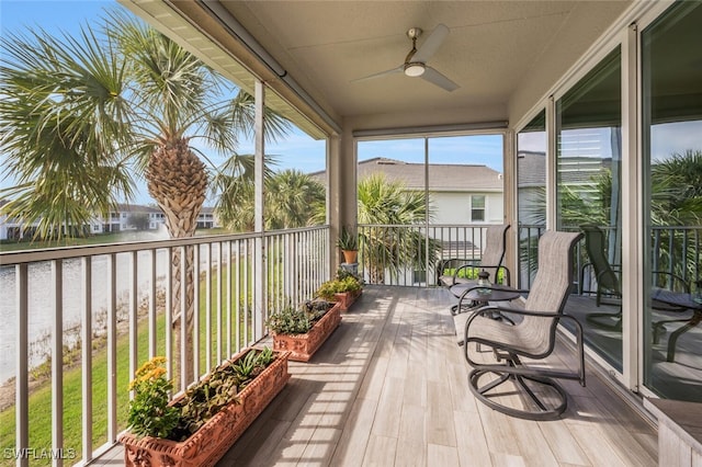 sunroom / solarium featuring ceiling fan