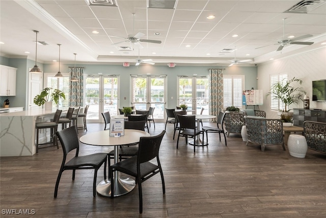 dining room featuring ceiling fan, dark hardwood / wood-style flooring, plenty of natural light, and french doors