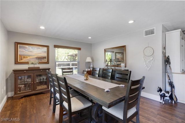 dining area with dark wood-type flooring