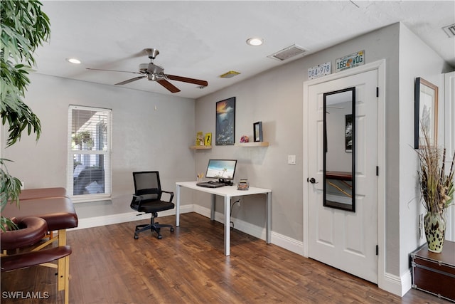 home office with ceiling fan and dark hardwood / wood-style floors