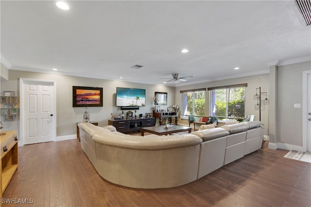 living room with crown molding, ceiling fan, and hardwood / wood-style floors