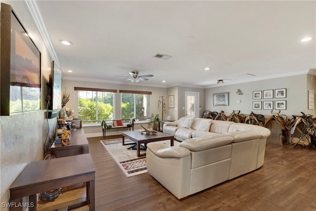 living room with ceiling fan, ornamental molding, and dark hardwood / wood-style flooring