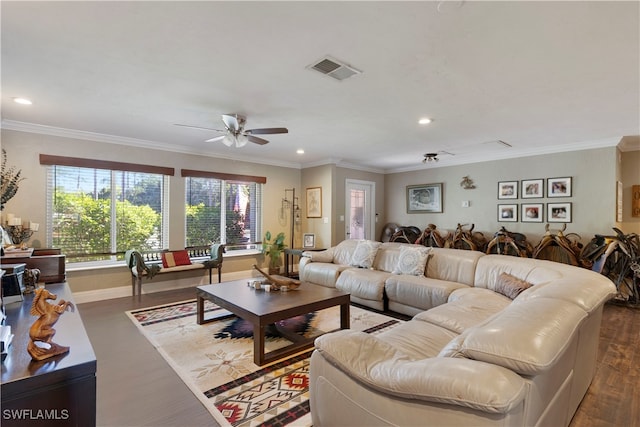 living room featuring hardwood / wood-style flooring, ornamental molding, and ceiling fan