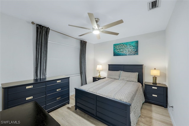 bedroom featuring light hardwood / wood-style floors and ceiling fan