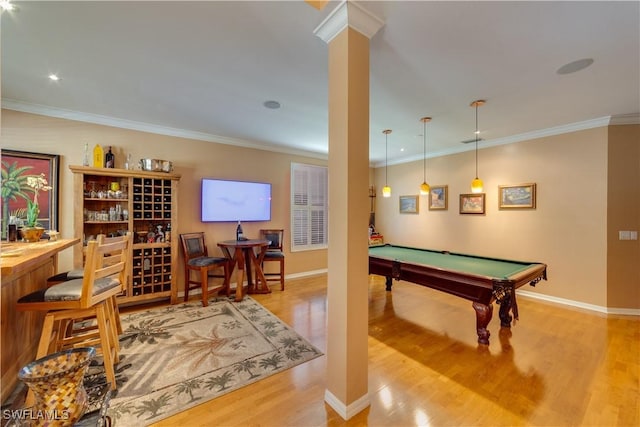 recreation room featuring light hardwood / wood-style floors, crown molding, and pool table