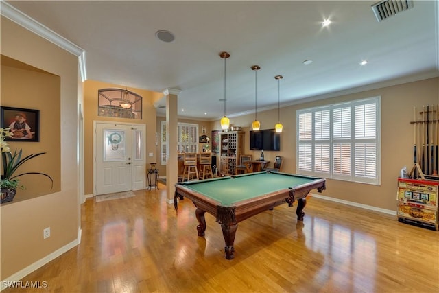 recreation room with decorative columns, ornamental molding, pool table, and light hardwood / wood-style flooring