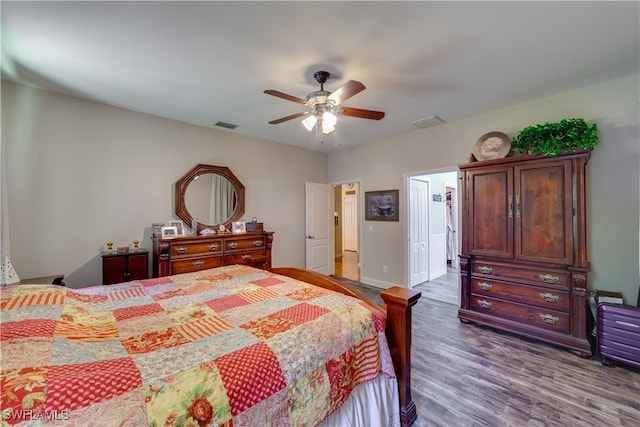 bedroom with hardwood / wood-style flooring and ceiling fan