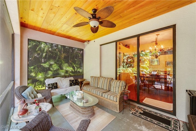 sunroom / solarium with wood ceiling and ceiling fan with notable chandelier