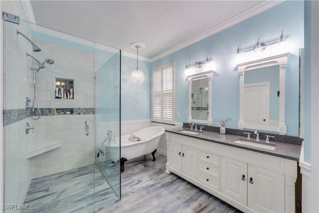 bathroom featuring hardwood / wood-style floors, vanity, shower with separate bathtub, and ornamental molding