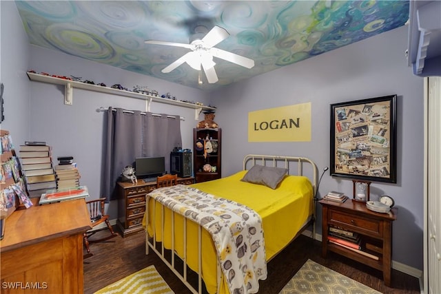 bedroom featuring ceiling fan and dark wood-type flooring