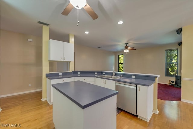5960 Grey Fox Run, Fort Myers, FL 33912 - kitchen with stainless steel dishwasher, a sink, ceiling fan, a peninsula, and dark countertops