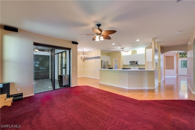 5960 Grey Fox Run, Fort Myers, FL 33912 - unfurnished living room with ceiling fan, arched walkways, baseboards, recessed lighting, and a chandelier