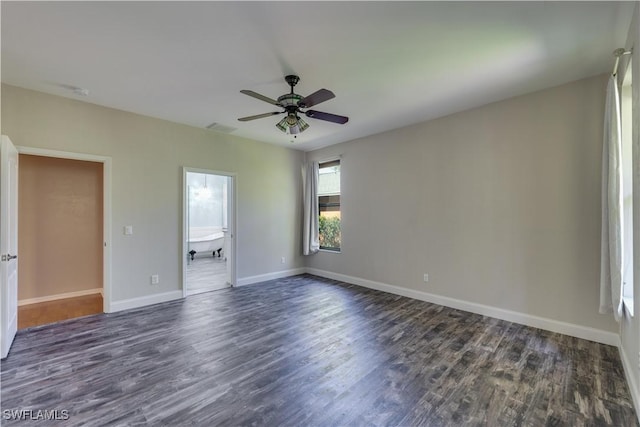 5960 Grey Fox Run, Fort Myers, FL 33912 - spare room with dark wood-type flooring, ceiling fan, and baseboards