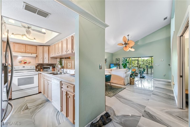 kitchen featuring ceiling fan, sink, light brown cabinets, lofted ceiling, and white appliances