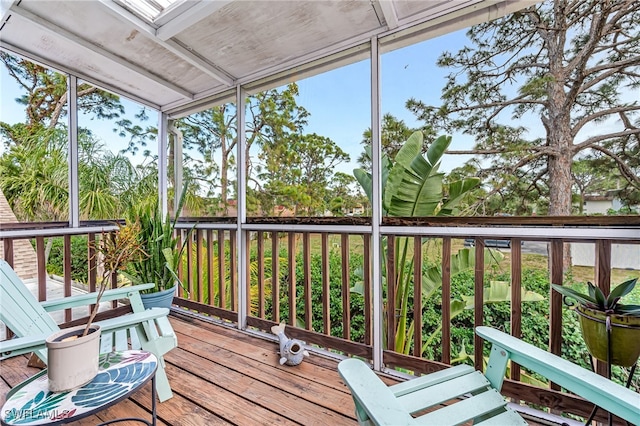 sunroom featuring plenty of natural light and a skylight