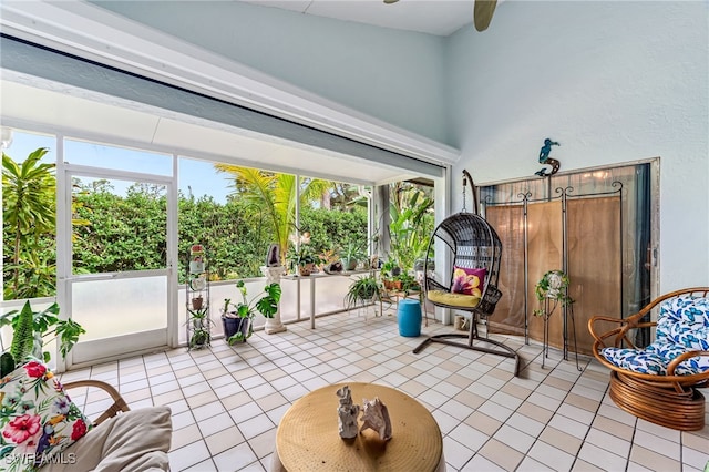 sunroom / solarium with plenty of natural light and ceiling fan