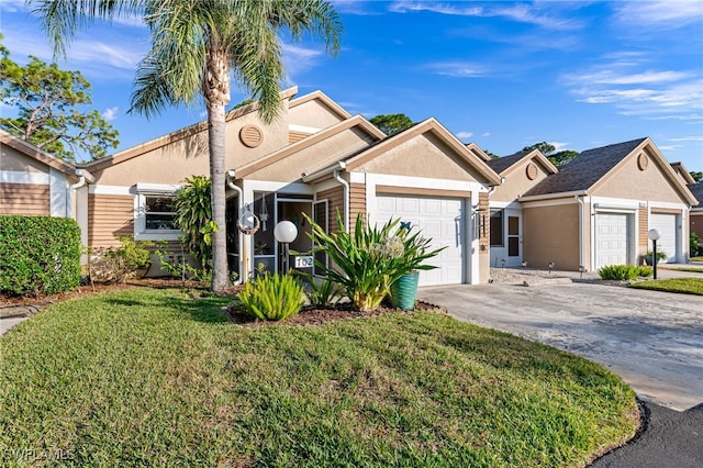 view of front of property featuring a garage and a front lawn