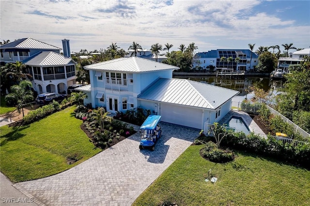 birds eye view of property featuring a water view