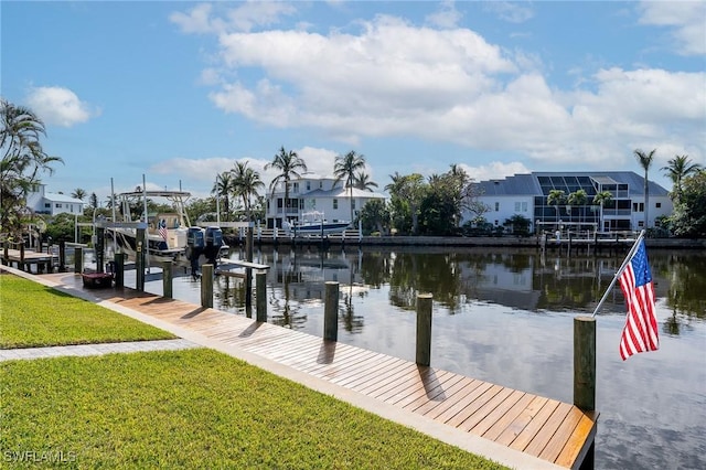 view of dock featuring a yard and a water view